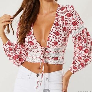 New never worn. Floral print, tie front top.
